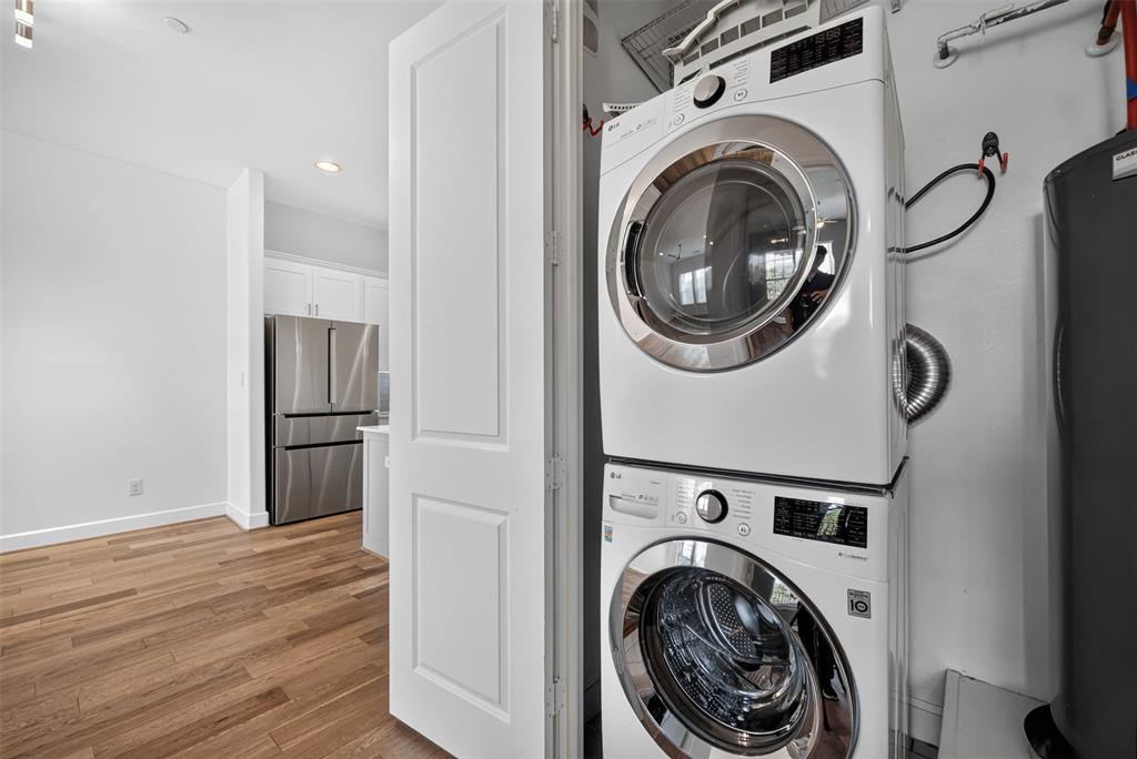 5015 Meridian Lane, Unit 2102 Addison, TX 75001 - Photo 27 of 36 Dedicated laundry closet featuring a stacked white washer and dryer unit