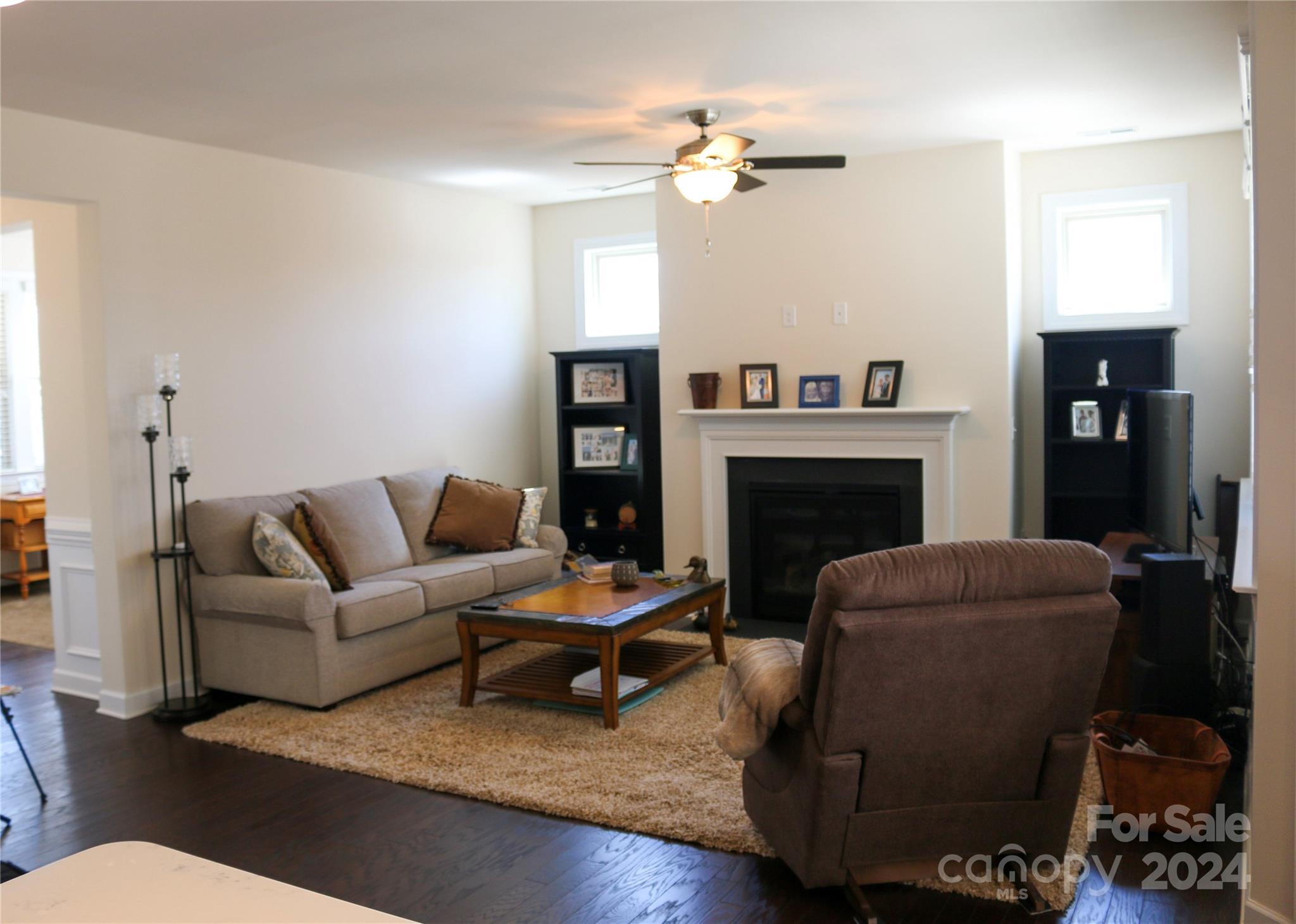 1296 Independence Street Tega Cay, SC 29708 - Photo 11 of 28 a living room with furniture and a fireplace