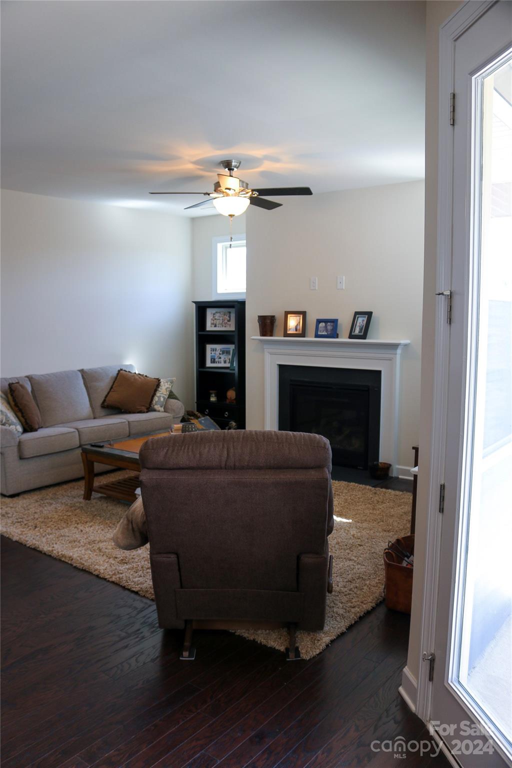 1296 Independence Street Tega Cay, SC 29708 - Photo 12 of 28 a living room with furniture and a fireplace