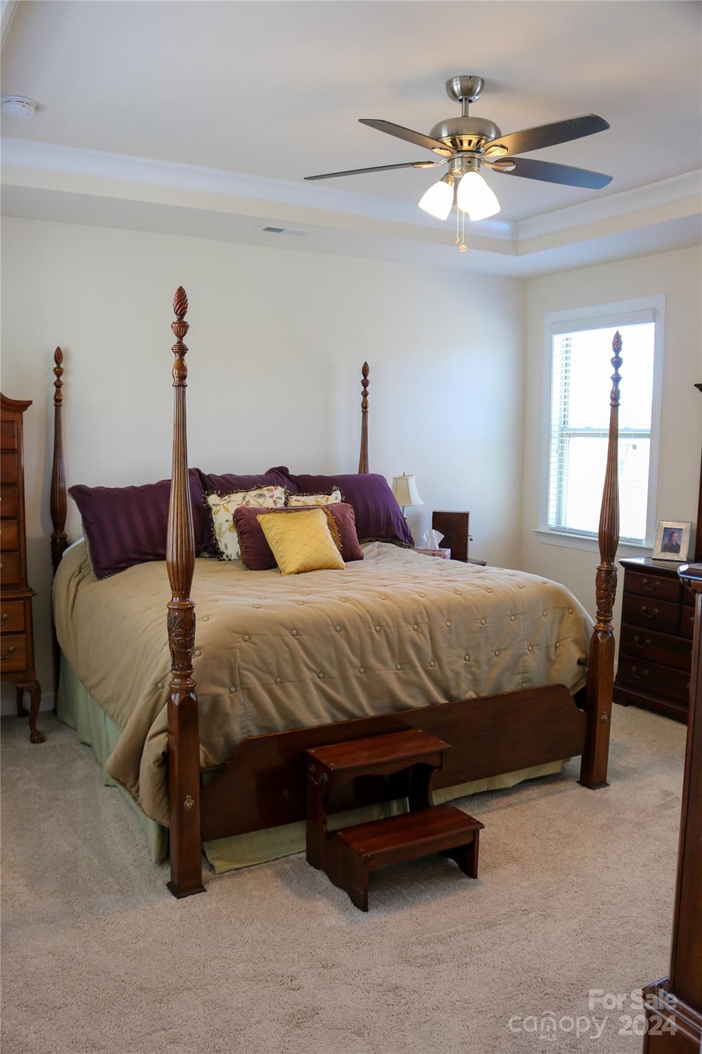 1296 Independence Street Tega Cay, SC 29708 - Photo 14 of 28 a bedroom with a bed and a chandelier