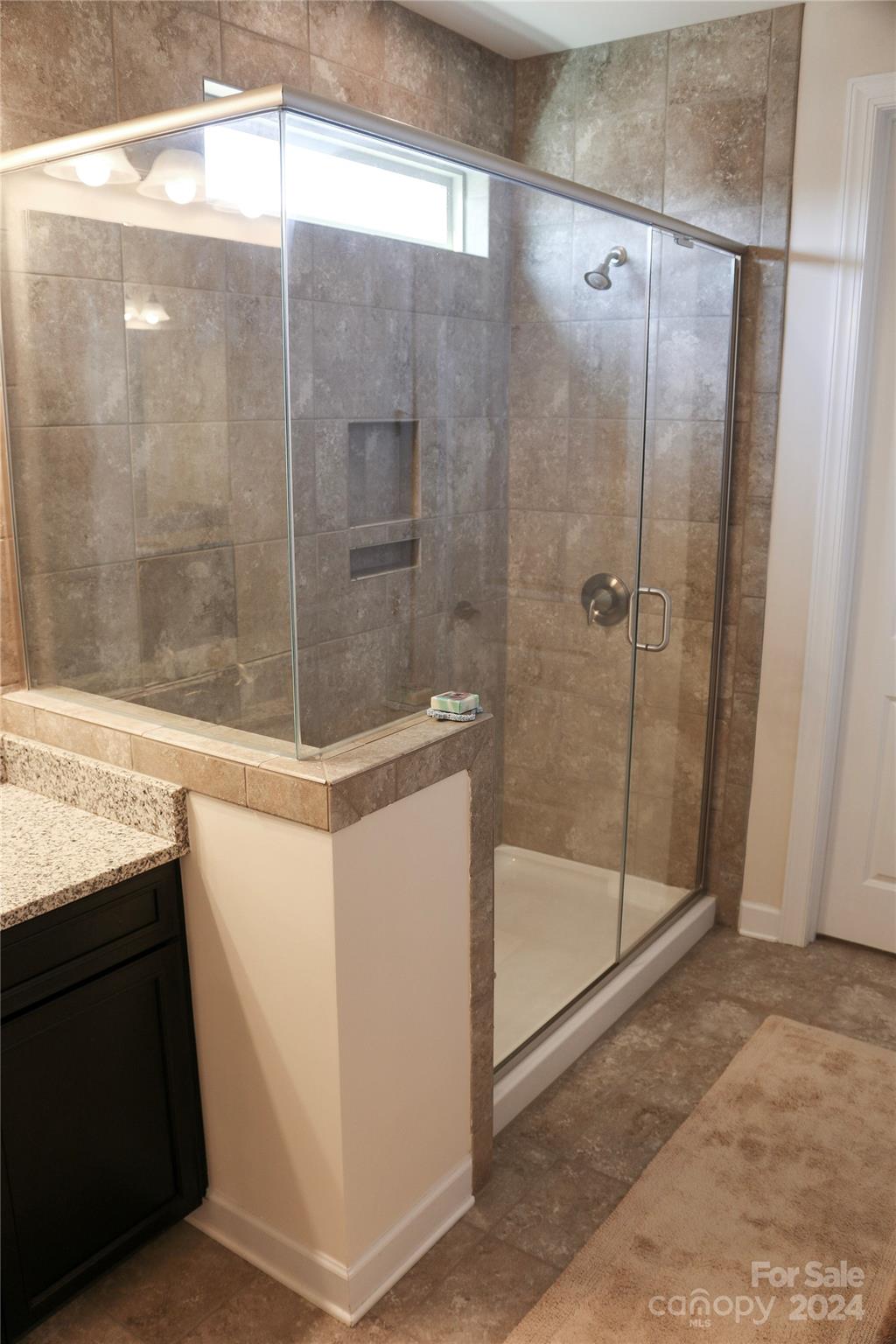 1296 Independence Street Tega Cay, SC 29708 - Photo 15 of 28 a bathroom with a shower and a sink