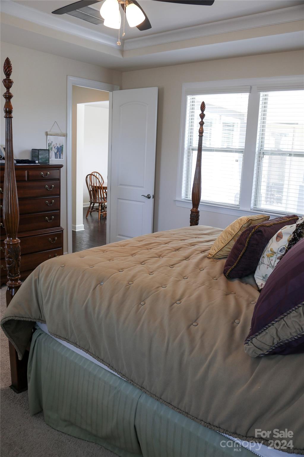 1296 Independence Street Tega Cay, SC 29708 - Photo 20 of 28 a bed sitting in a bedroom next to a window