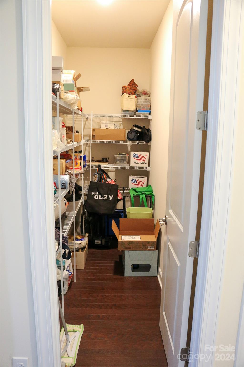 1296 Independence Street Tega Cay, SC 29708 - Photo 24 of 28 a room with furniture and a book shelf