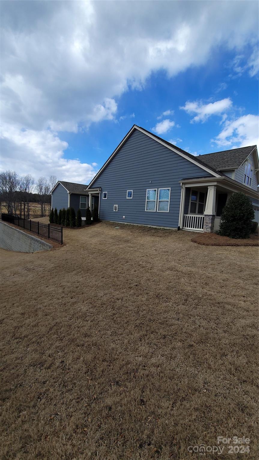 1296 Independence Street Tega Cay, SC 29708 - Photo 26 of 28 a house view with a garden space