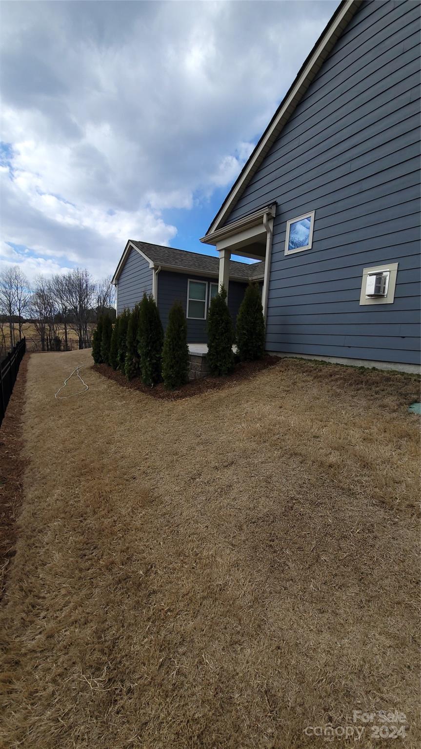 1296 Independence Street Tega Cay, SC 29708 - Photo 27 of 28 a front view of house with yard and car parked