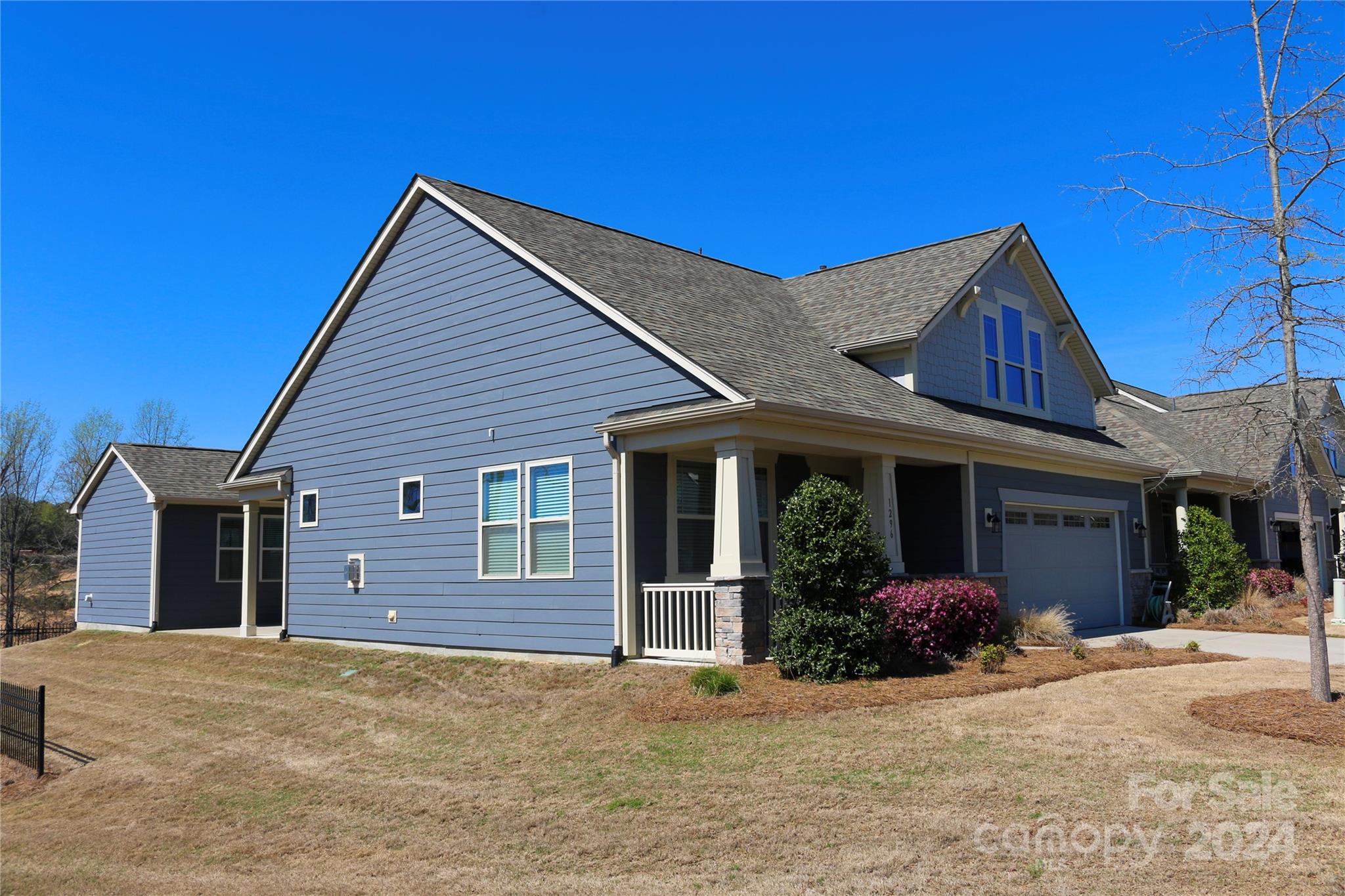 1296 Independence Street Tega Cay, SC 29708 - Photo 3 of 28 a view of a house with a yard and garage