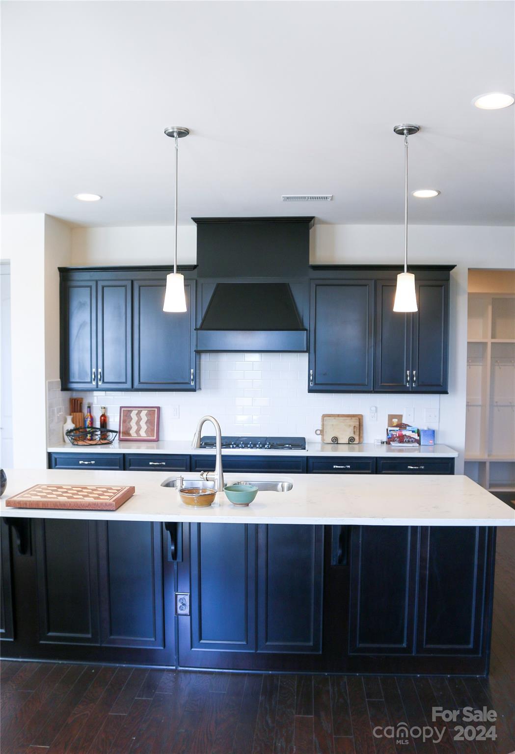1296 Independence Street Tega Cay, SC 29708 - Photo 6 of 28 a kitchen with lots of counter space and a sink