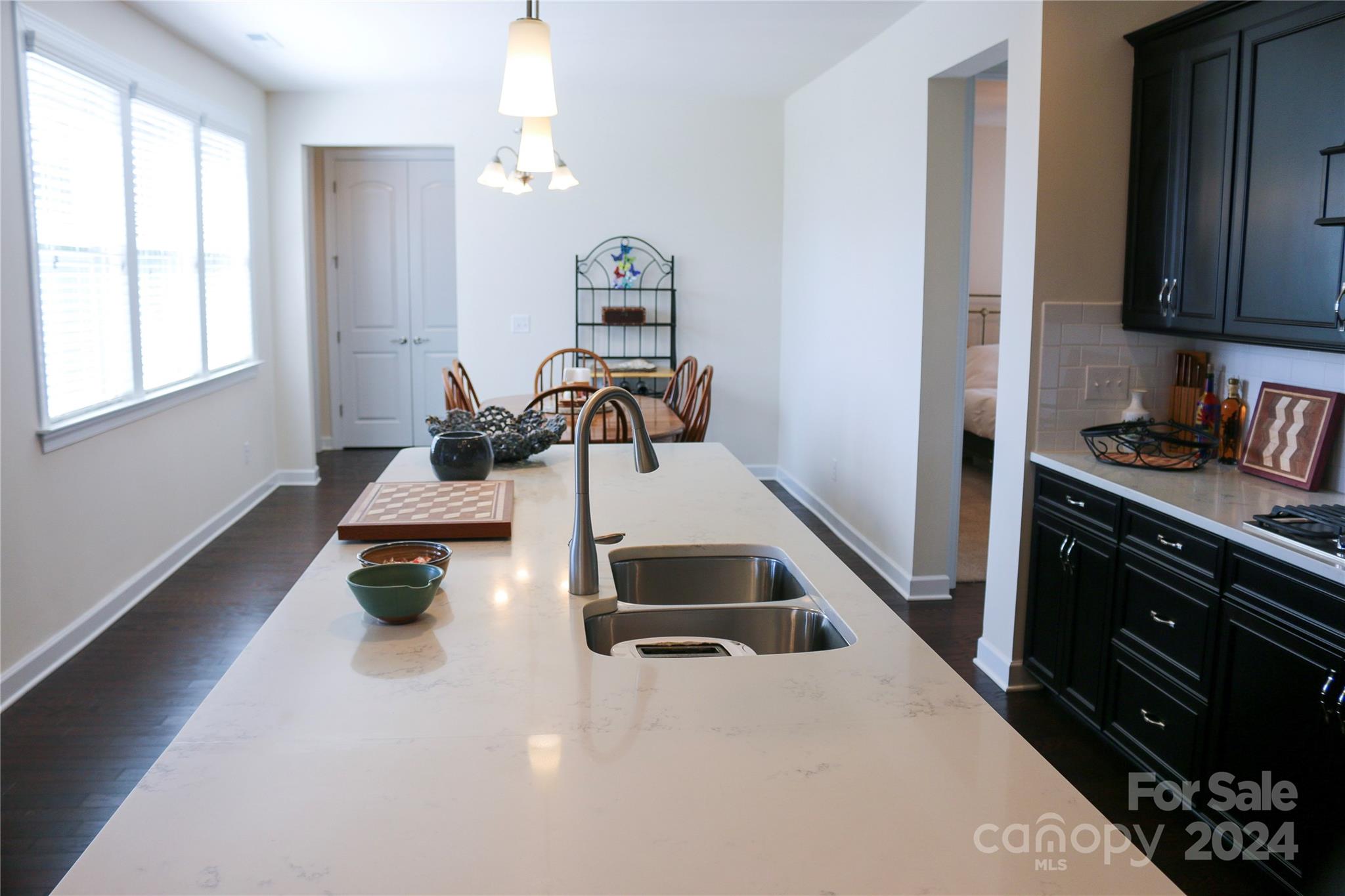 1296 Independence Street Tega Cay, SC 29708 - Photo 8 of 28 a kitchen with sink refrigerator and window