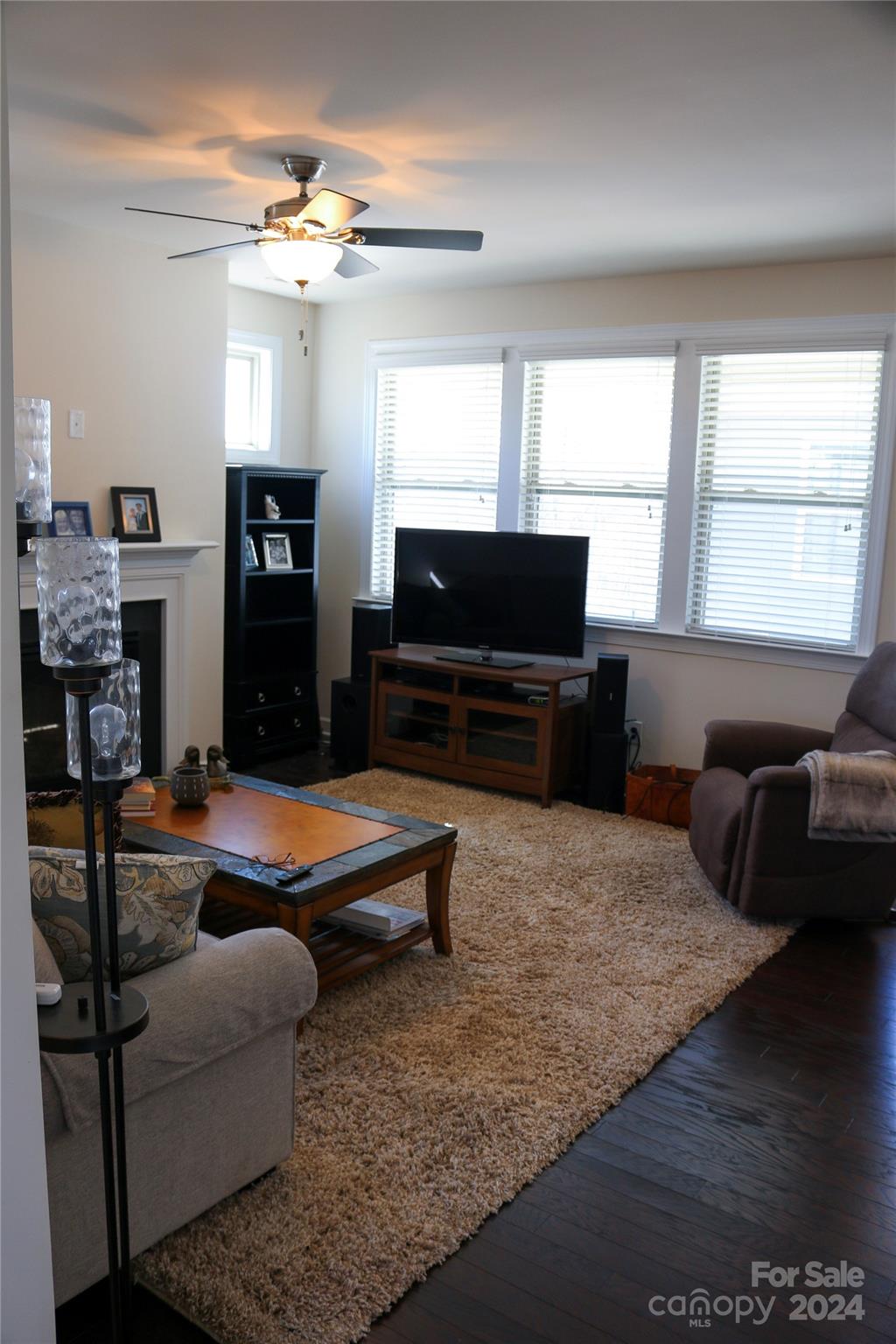 1296 Independence Street Tega Cay, SC 29708 - Photo 9 of 28 a living room with furniture and a flat screen tv
