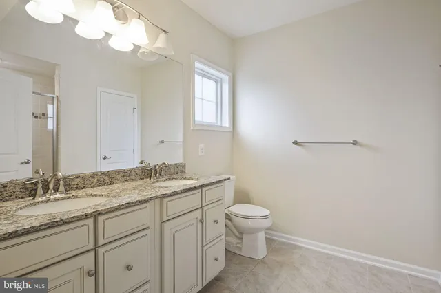 a bathroom with a shower and a glass door