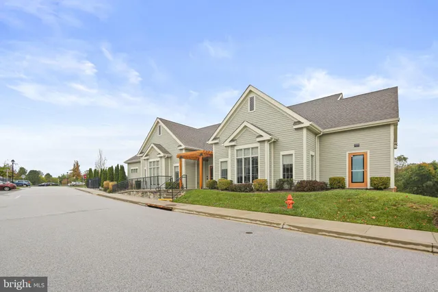 a view of a house with a street