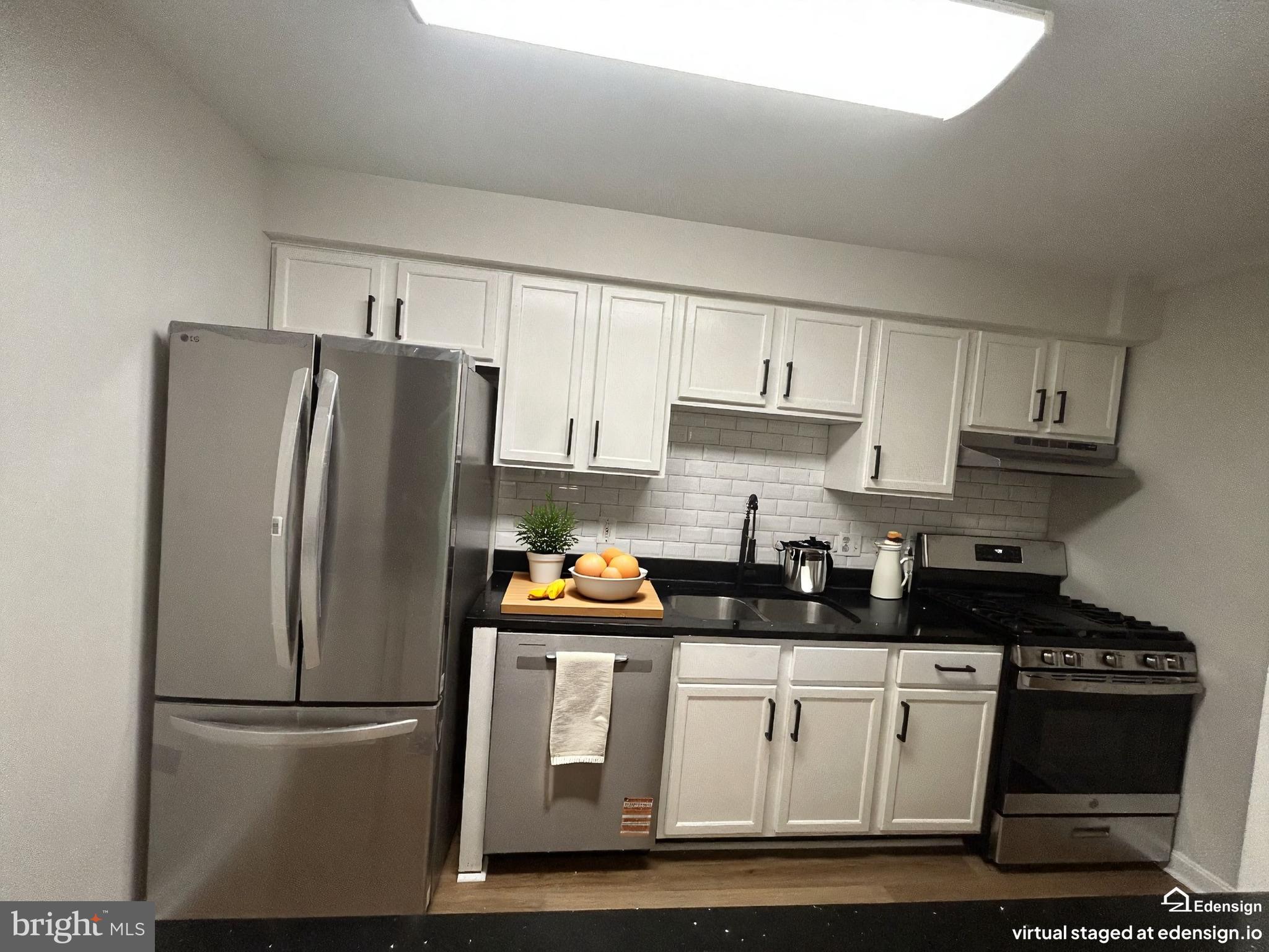 635 Waterloo Road, Unit 222 Warrenton, VA 20186 - Photo 15 of 28 a kitchen with stainless steel appliances granite countertop a refrigerator sink and white cabinets