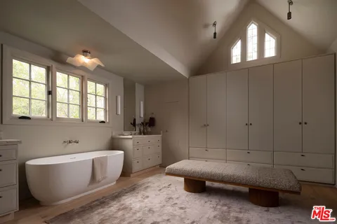 a view of hallway with livingroom and furniture