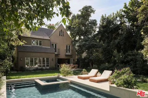 a front view of house with yard outdoor seating and green space
