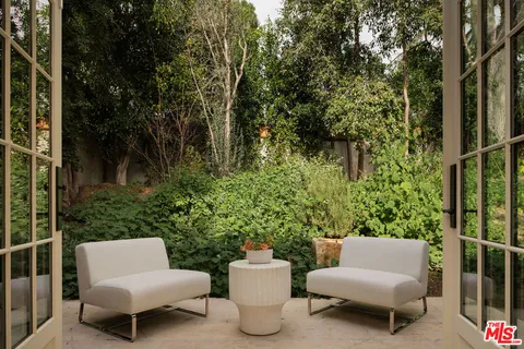 a bedroom with a bed and a rug