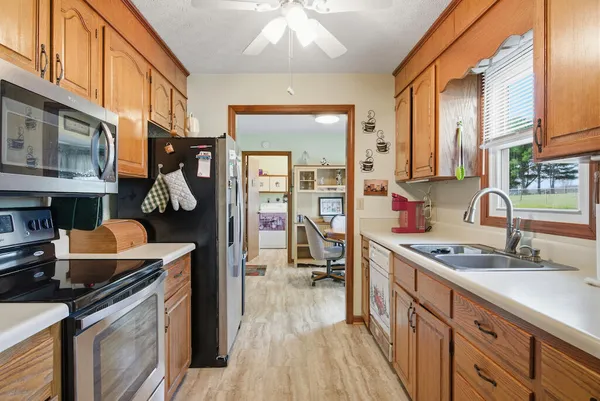 a kitchen that has a lot of cabinets in it