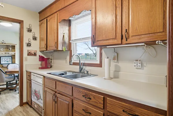 a kitchen with stainless steel appliances granite countertop a sink and cabinets