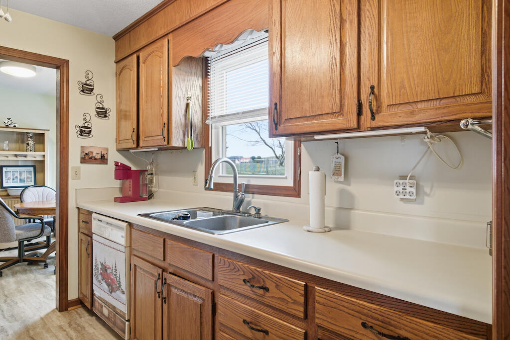 6389 Ruebush Road Dublin, VA 24084 - Photo 18 of 63 a kitchen with stainless steel appliances granite countertop a sink and cabinets