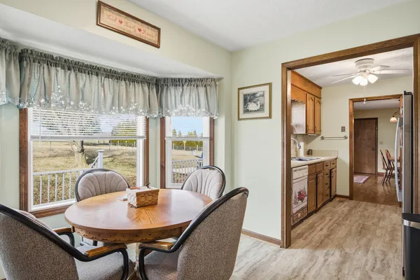 a dining room with furniture and window