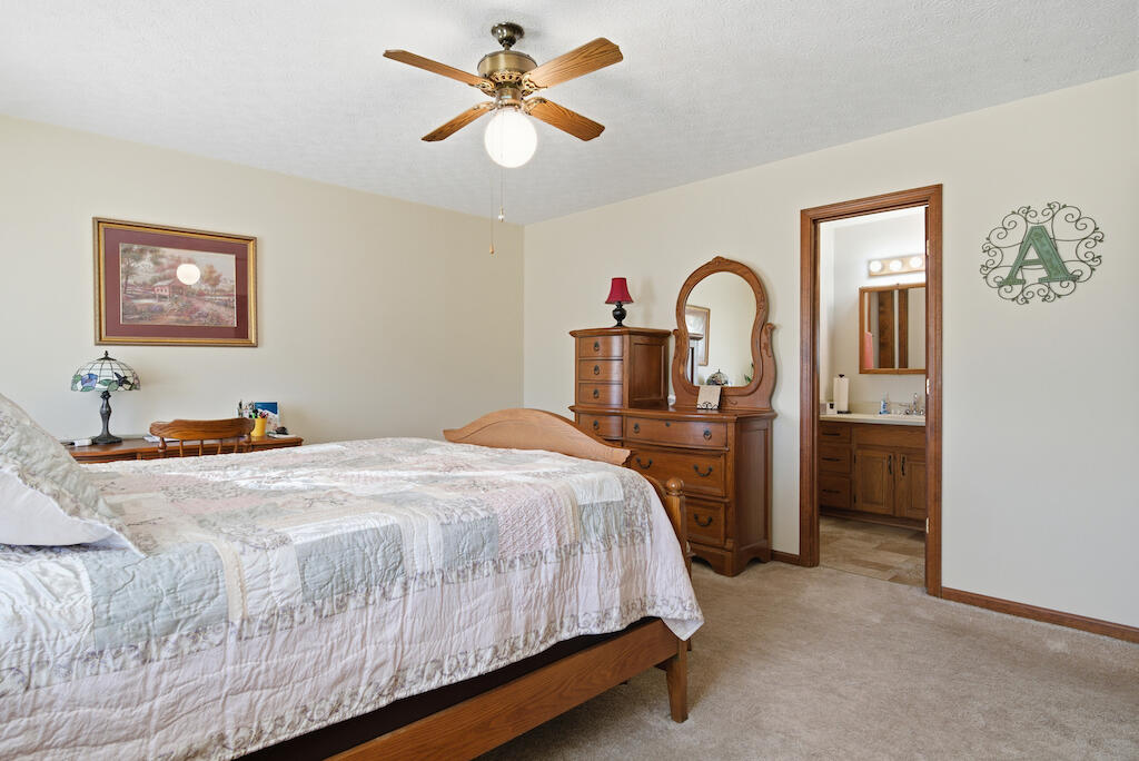 6389 Ruebush Road Dublin, VA 24084 - Photo 24 of 63 a spacious bedroom with a bed and a table