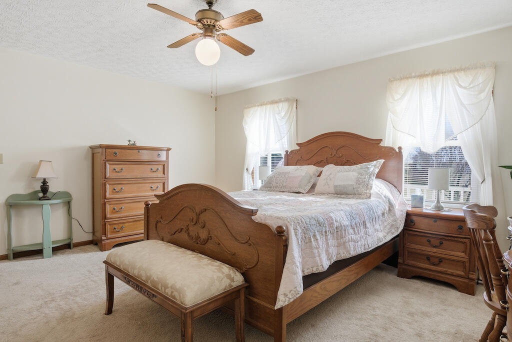 6389 Ruebush Road Dublin, VA 24084 - Photo 25 of 63 a bedroom with a bed and a chandelier