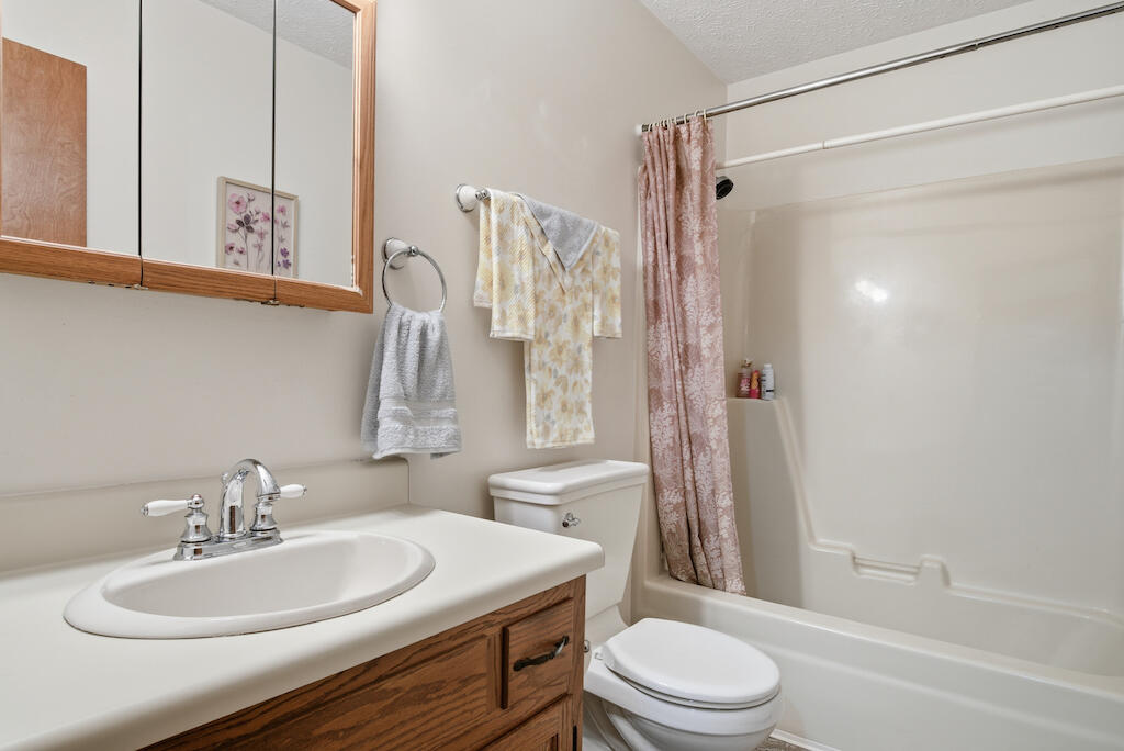 6389 Ruebush Road Dublin, VA 24084 - Photo 31 of 63 a bathroom with a sink a toilet and shower