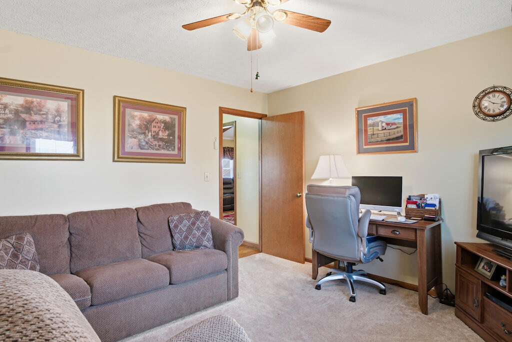 6389 Ruebush Road Dublin, VA 24084 - Photo 33 of 63 a living room with furniture and a flat screen tv