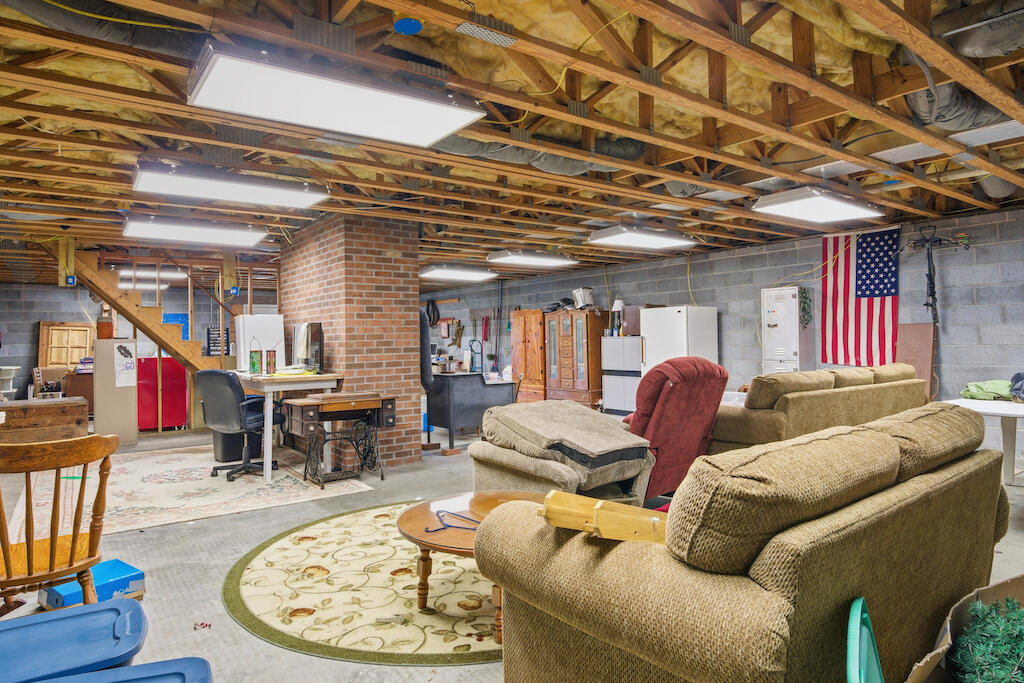 6389 Ruebush Road Dublin, VA 24084 - Photo 36 of 63 a living room with furniture and a wooden floor