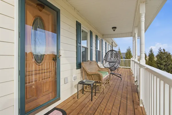 a view of balcony with furniture