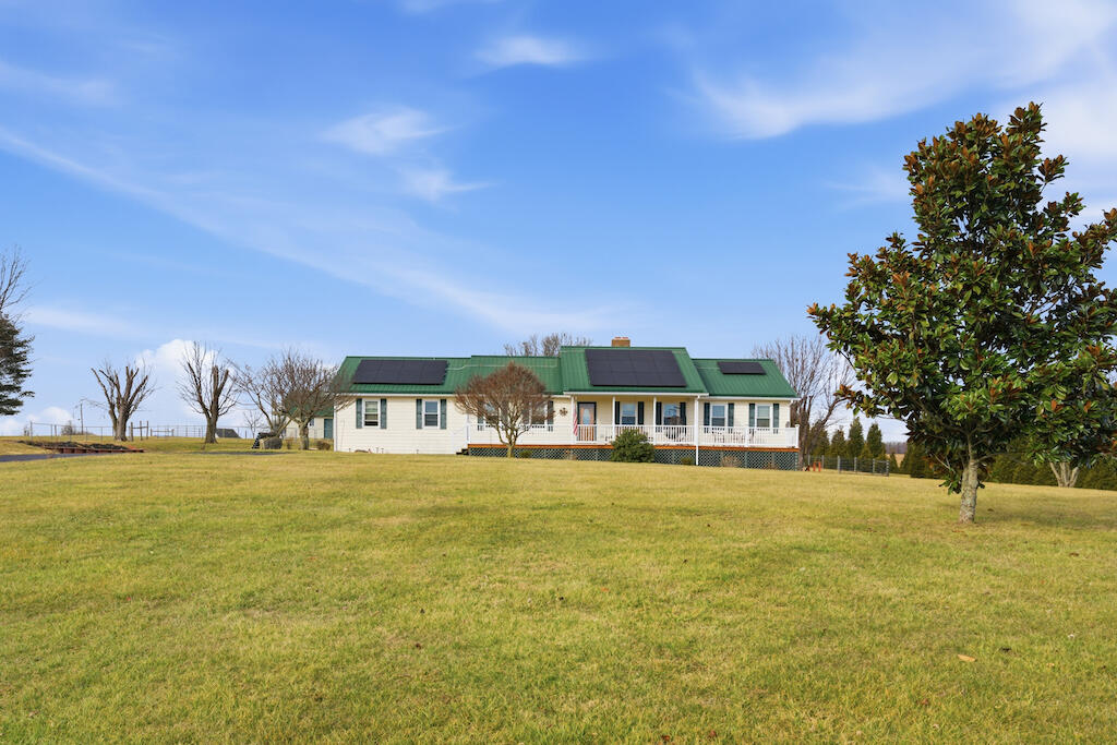 6389 Ruebush Road Dublin, VA 24084 - Photo 50 of 63 a front view of a building with a yard