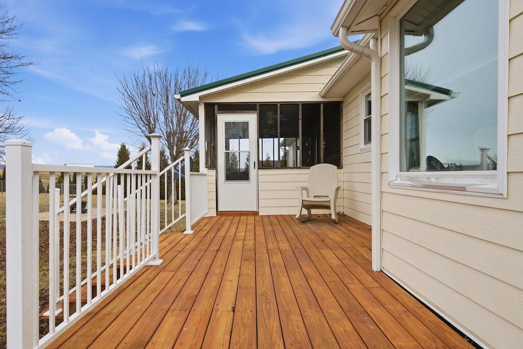 6389 Ruebush Road Dublin, VA 24084 - Photo 60 of 63 a balcony with wooden floor table and chairs