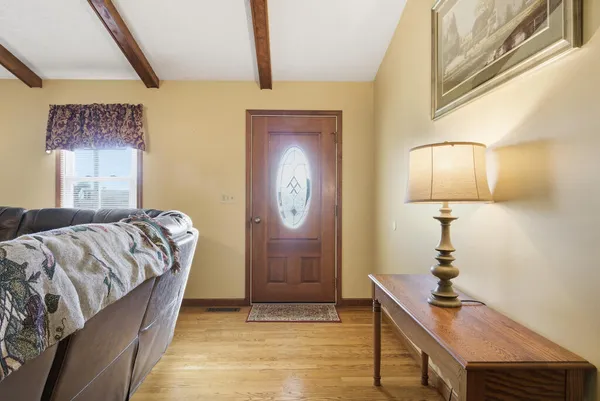a bedroom with a bed and a mirror