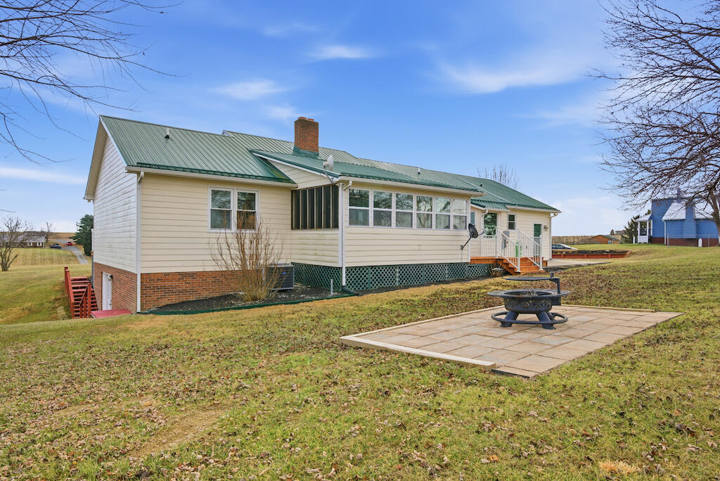 6389 Ruebush Road Dublin, VA 24084 - Photo 62 of 63 a front view of a house with a yard
