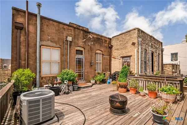 a view of balcony with furniture