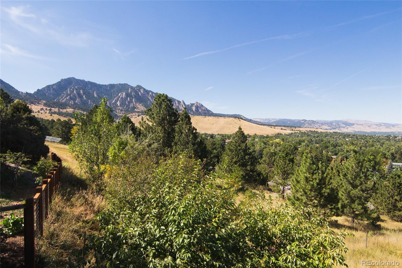 2895 Lafayette Drive Boulder, CO 80305 - Photo 3 of 12 a view of a city with lush green forest