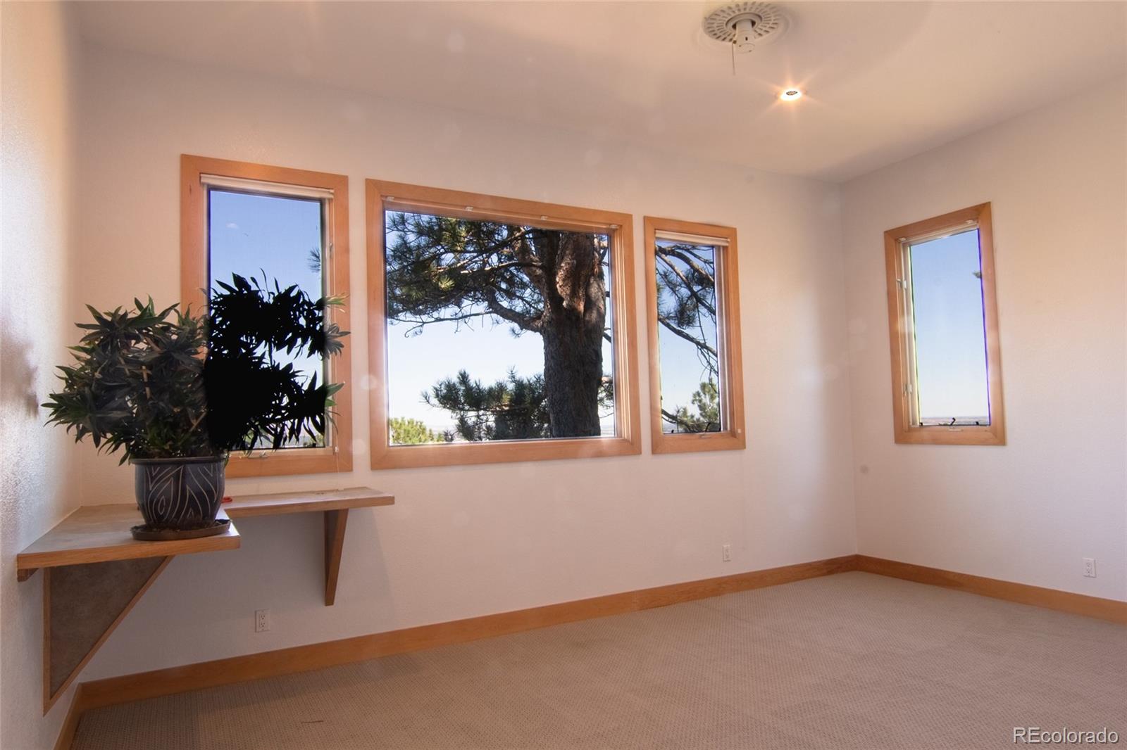 2895 Lafayette Drive Boulder, CO 80305 - Photo 6 of 12 an empty room with a window