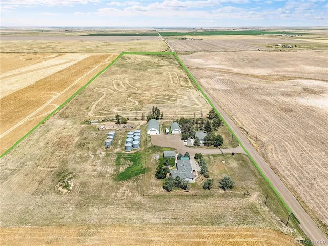 a view of a house with a yard and garage