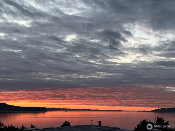 a view of balcony with outdoor seating and wooden floor