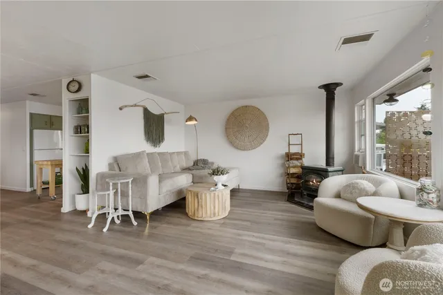 a view of a dining room with furniture and a large window
