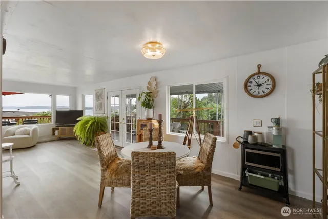 a view of a workspace with furniture and a potted plant