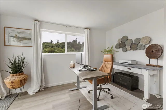 a bathroom with a sink mirror and vanity