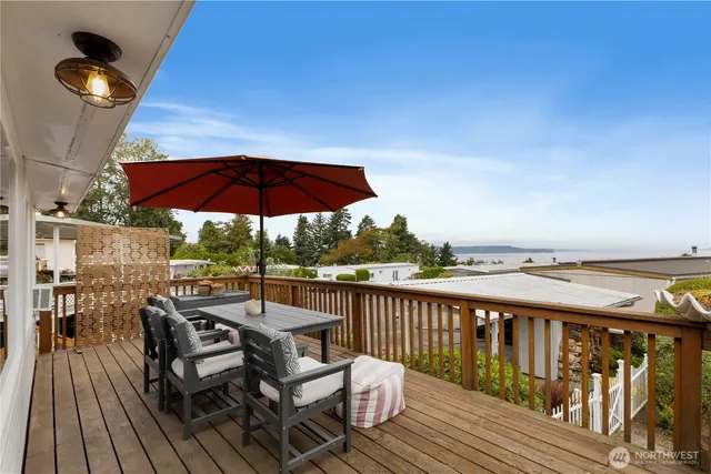 a view of balcony with outdoor seating and wooden floor