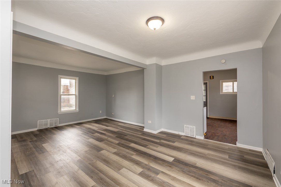 15328 Shiloh Road Cleveland, OH 44110 - Photo 16 of 27 Unfurnished room with baseboards and dark wood-style flooring