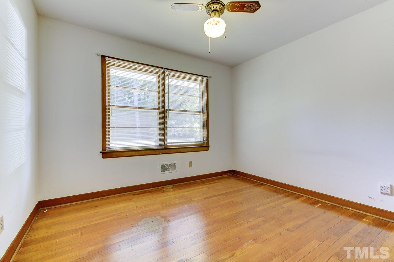 3912 Buffaloe Road Raleigh, NC 27604 - Photo 6 of 8 a view of an empty room with a window