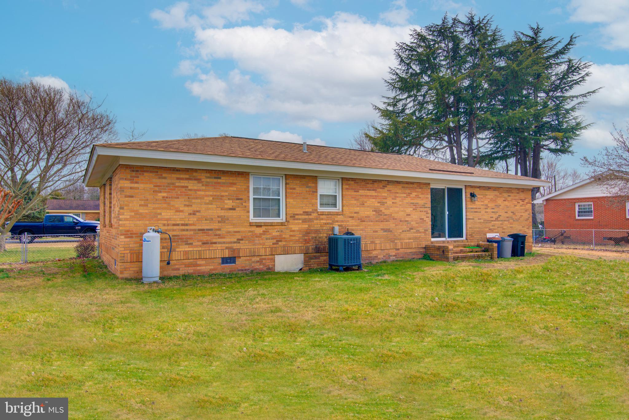 62 Darl Circle Colonial Beach, VA 22443 - Photo 11 of 47 a front view of house with yard and trees