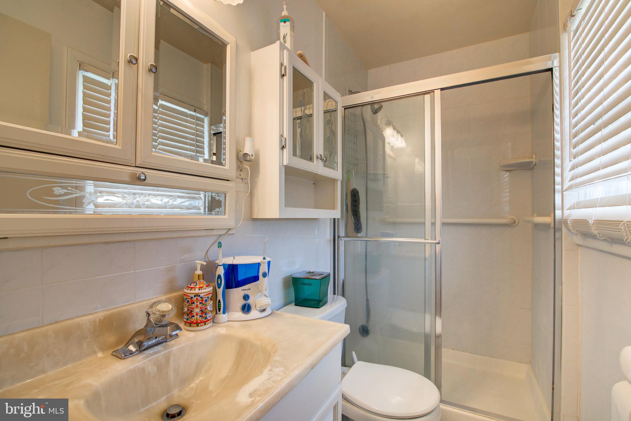 62 Darl Circle Colonial Beach, VA 22443 - Photo 26 of 47 a bathroom with a sink toilet and shower