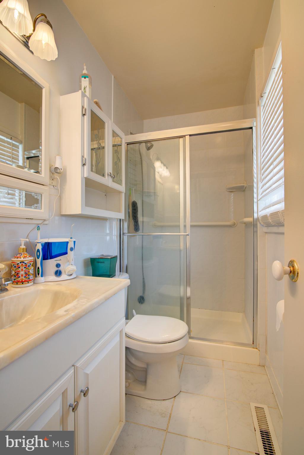 62 Darl Circle Colonial Beach, VA 22443 - Photo 27 of 47 a bathroom with a sink a toilet and shower