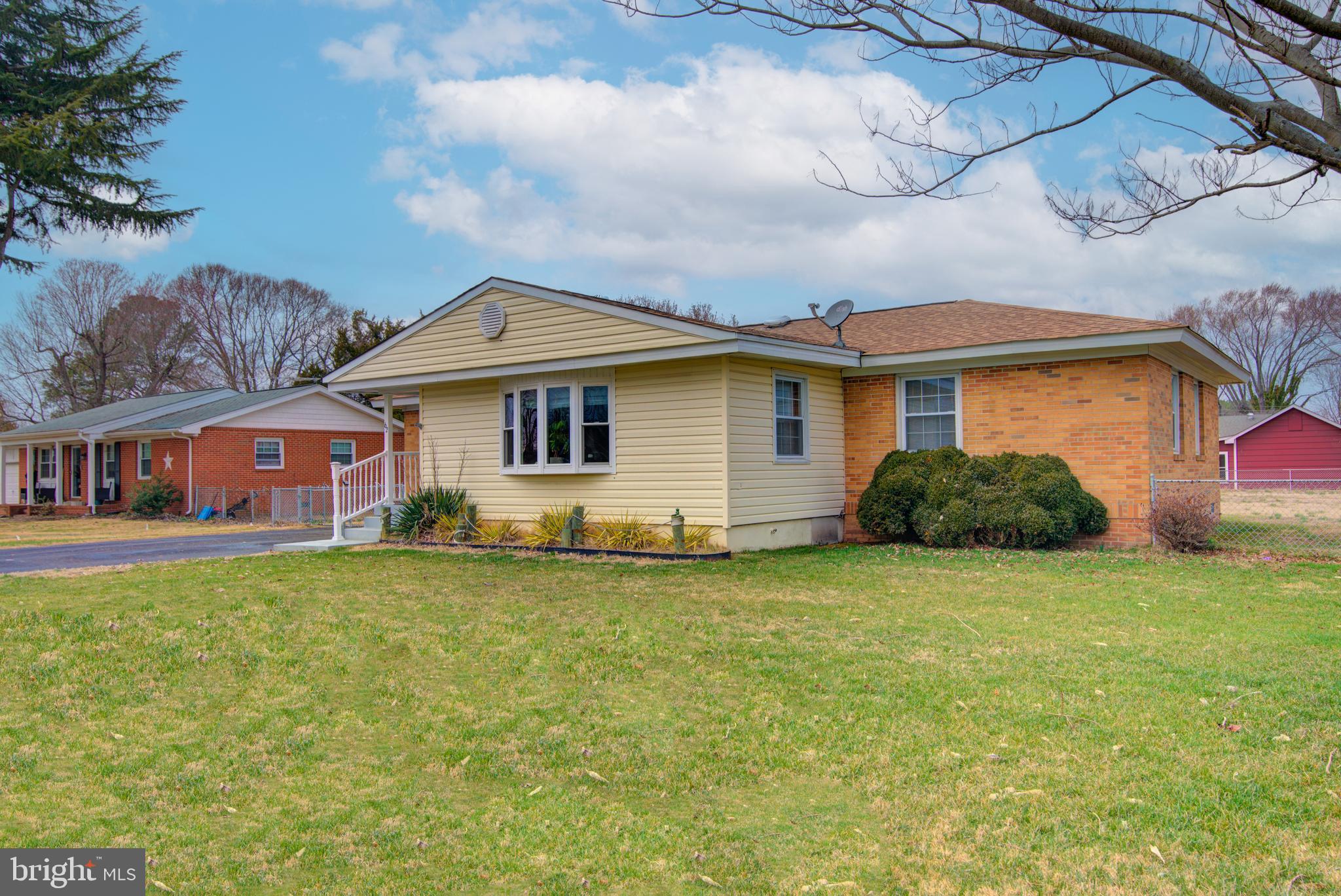 62 Darl Circle Colonial Beach, VA 22443 - Photo 5 of 47 a front view of a house with garden
