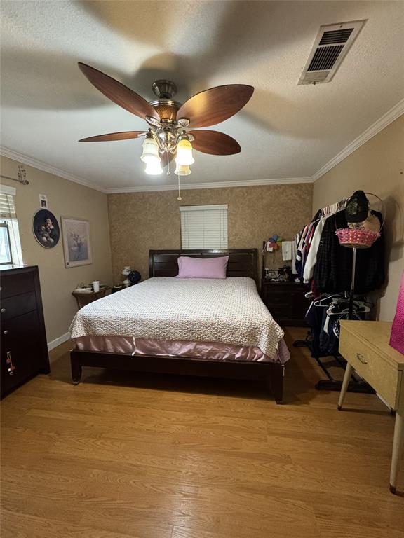 636 East Kempner Street Mabank, TX 75147 - Photo 28 of 28 Wood-finish flooring throughout, complemented by a ceiling fan with integrated lighting