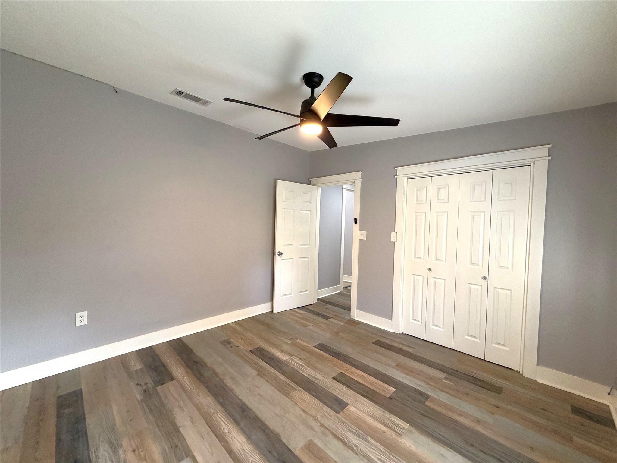 410 North Elm Street Trinity, TX 75862 - Photo 20 of 20 a view of room with a ceiling fan and window